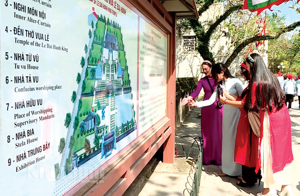 Tourists scan QR code system to learn more information about Hoa Lu ancient capital.