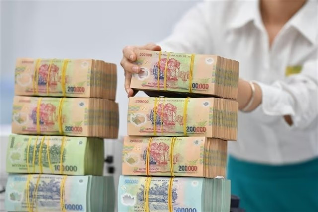 The State Treasury has so far this year continued to expand the coordination of electronic bilateral collection and payment with 20 major commercial banks. (Photo: cafef.vn)